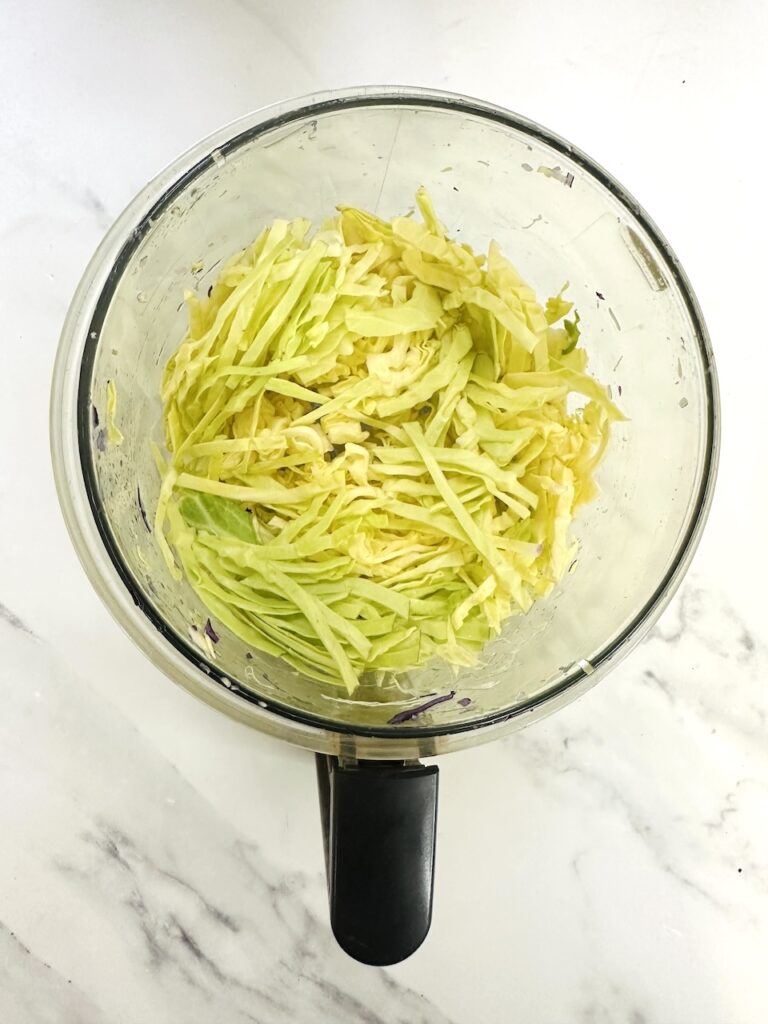 food processor with shredded cabbage