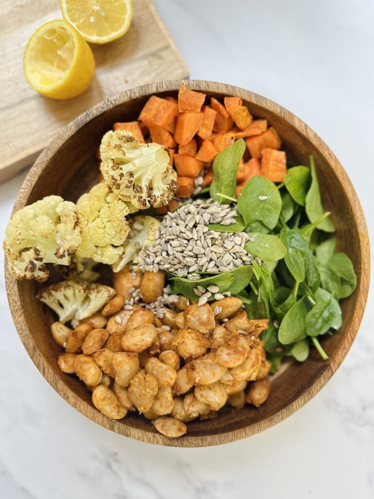roasted butter beans with cauliflower sweet potato and sunflower seeds
