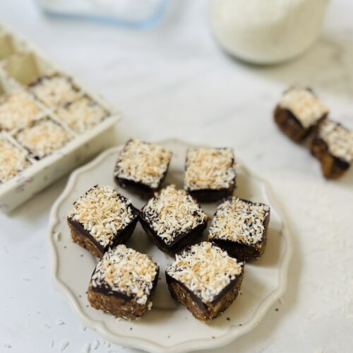 mini apricot bites made in an ice cube tray with dates and coconut