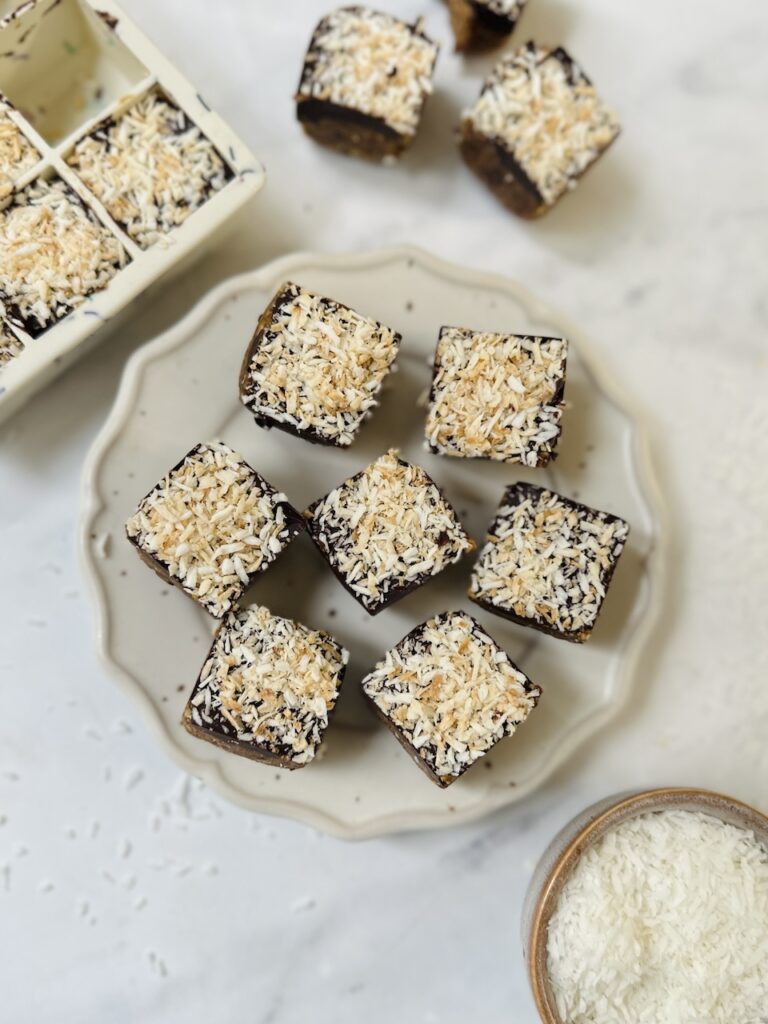 mini apricot bites made in an ice cube tray with dates and coconut