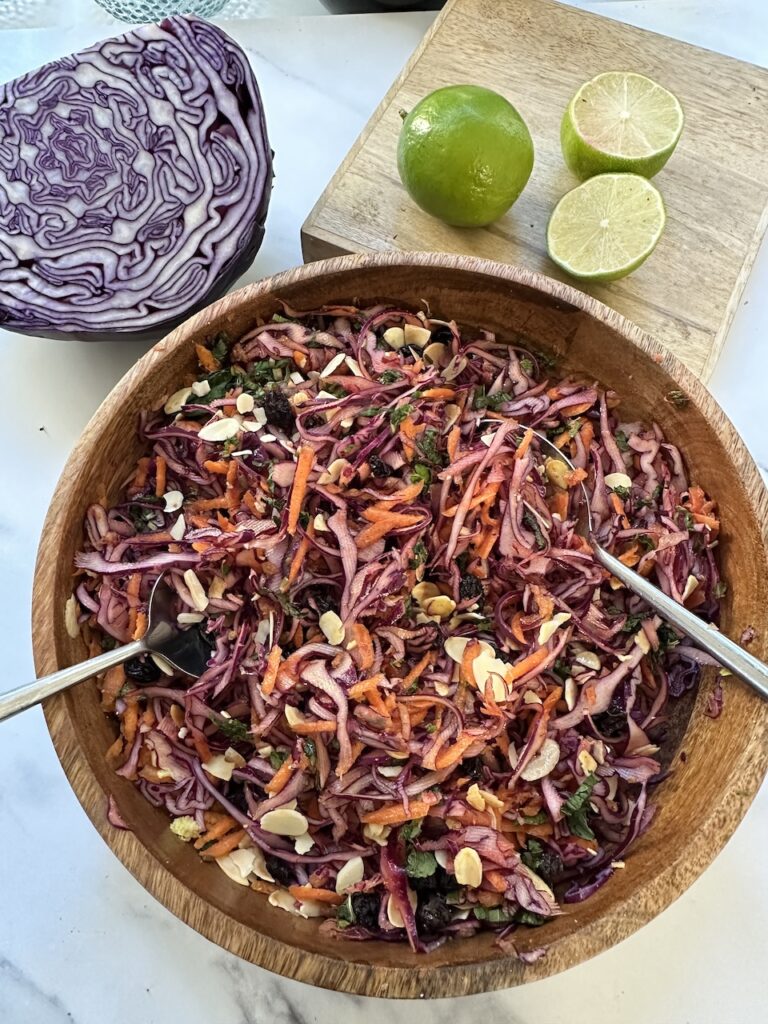 spicy red cabbage salad with carrots, onions and a spiced dressing