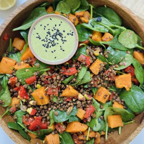 crispy lentil salad with sweet potatoes, peppers and pistachio green dressing