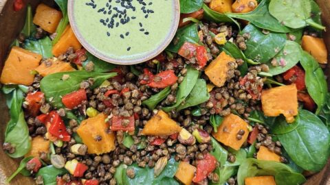 crispy lentil salad with sweet potatoes, peppers and pistachio green dressing