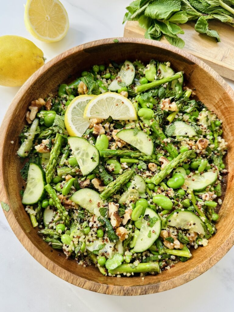 ultimate spring salad in wooden bowl