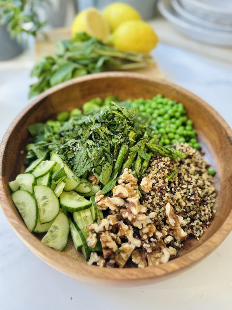 ultimate spring salad in wooden bowl