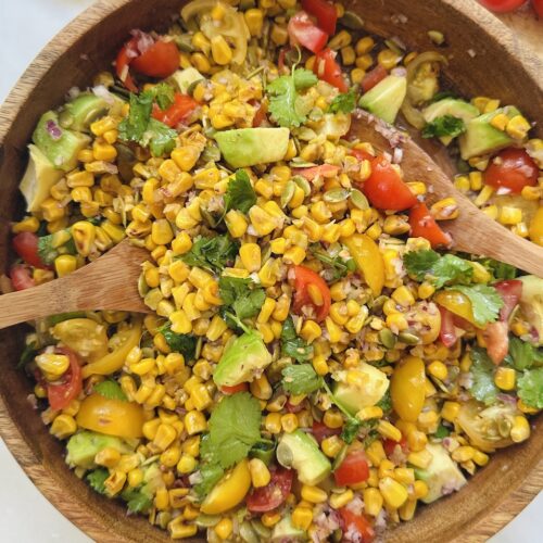 charred corn salad with tomatoes, olives, avocado and cilantro