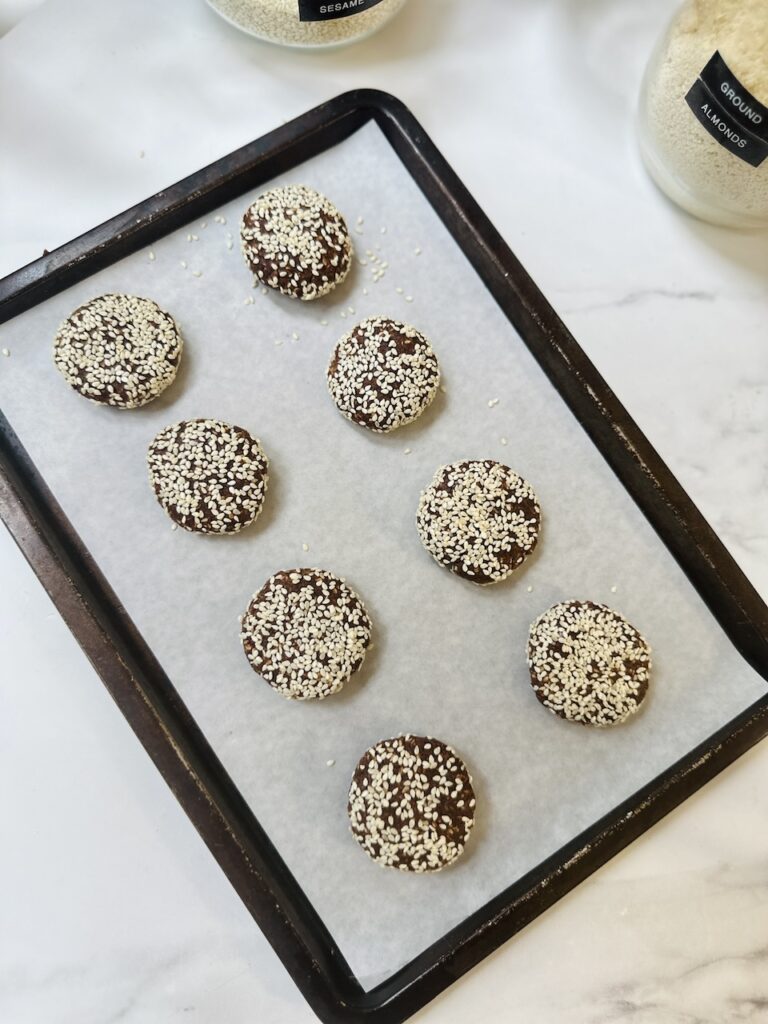 sesame cookies with cacao on a baking tray
