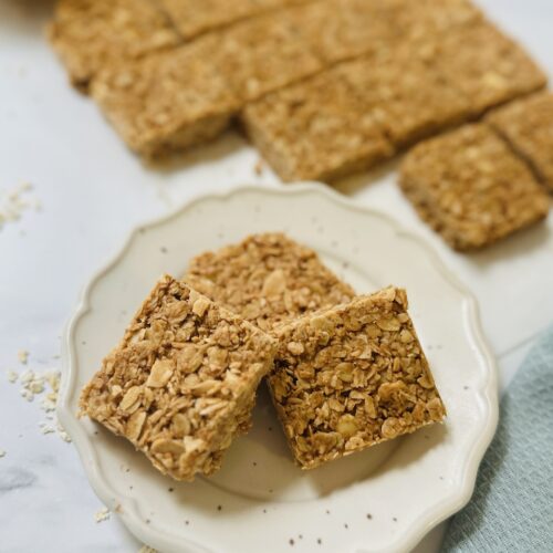 no bake oat bars with coconut and almonds on a plate
