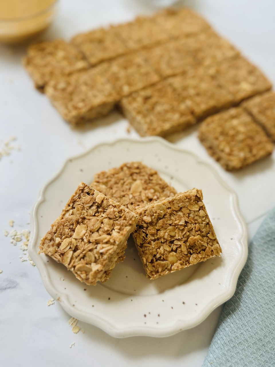 no bake oat bars with coconut on plate no bake oat bars with coconut and almonds on a plate