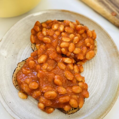 close up of homemade beans on toast on a plate