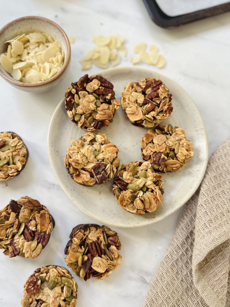 nut clusters on a plate made with pecans, almonds and pumpkin seeds