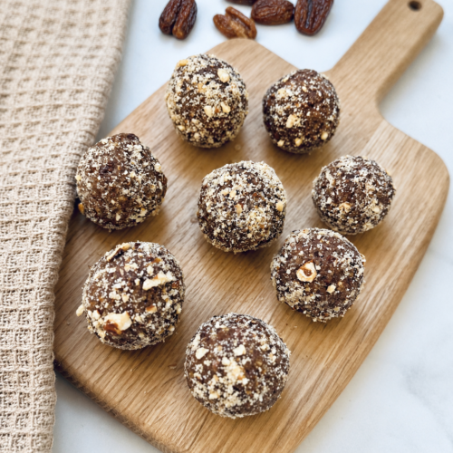 pecan pie energy ball on a wooden cutting board